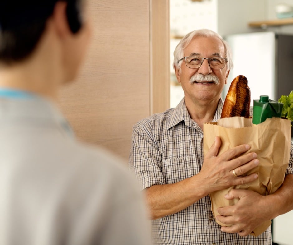 Senior man receiving groceries